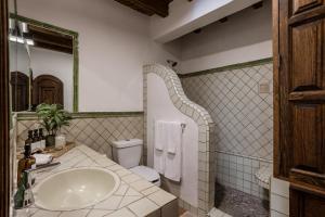 a bathroom with a sink and a toilet at 3BR Garden Home with Rooftop & Garage in Centro San Miguel de Allende in San Miguel de Allende +25 photos