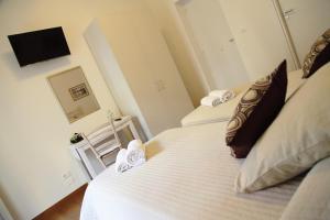 A bed or beds in a room at B&B Evelyne