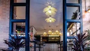 a window view of a restaurant with tables and chairs at 103 Wonderful House in Bogotá