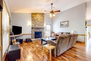 a living room with a couch and a fireplace at Horizon Hideaway in Mashburn Mill