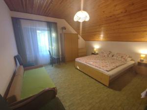 a bedroom with a bed and a large window at Holiday home in Balatonboglar 45807 in Balatonboglár