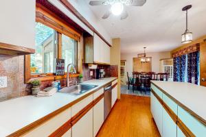 a kitchen with a sink and a counter top at Whispering Woods in East Stroudsburg