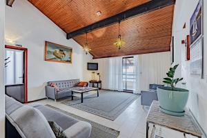 a living room with a couch and a table at Apartments by the sea Prigradica, Korcula - 627 in Blato
