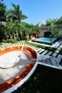 a backyard with a swimming pool and a resort at Lukas Garden Accra in Accra