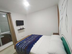Postel nebo postele na pokoji v ubytování Apartalofts Cali - Parque del Perro 30 m2