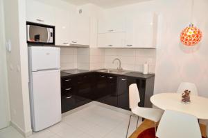Kuchyň nebo kuchyňský kout v ubytování Golden Gate Apartment Zadar
