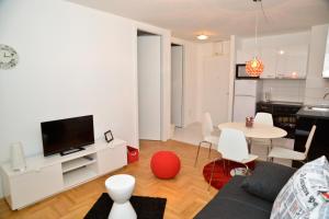 a living room with a couch and a table at Golden Gate Apartment Zadar in Zadar