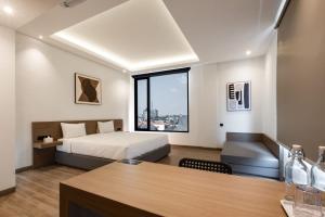 Katil atau katil-katil dalam bilik di Assa Hotel
