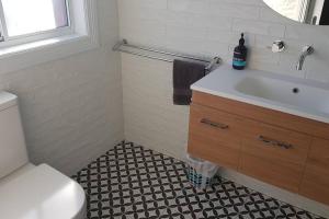a bathroom with a sink and a toilet at 'Ampleforth East' in Albury