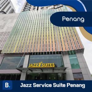 a building with a taxi services sign on it at Jazz Service Suite Penang in Tanjong Tokong