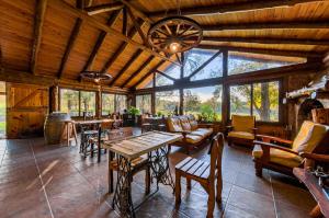 a large living room with a table and chairs at GLAMPING TICA NATIVO in Villa Carlos Paz