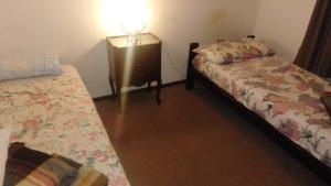 Postel nebo postele na pokoji v ubytování Hostel Las Tejas