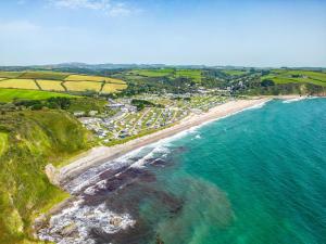 an aerial view of a beach and the ocean at The Steps in Pentewan