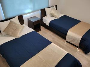 A bed or beds in a room at Villa Ortigia