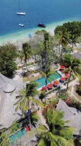 an aerial view of a resort with a swimming pool at Amahelia Luxury Resort & Restaurant - Gili Asahan in Gili Asahan