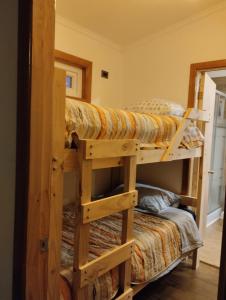 a bunk bed room with two bunk beds at Cabaña / loft in Puerto Montt