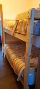 a couple of bunk beds in a room at Cabaña / loft in Puerto Montt
