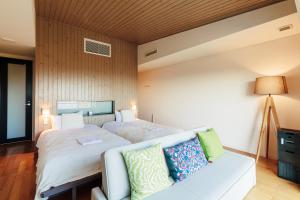 Giường trong phòng chung tại the salon 伊豆高原 Hotels & Resort
