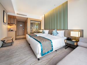 Łóżko lub łóżka w pokoju w obiekcie Qin Huang Yong An Boutique Hotel