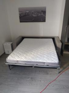 a mattress on a bed frame in a room at Xoel in Muxia