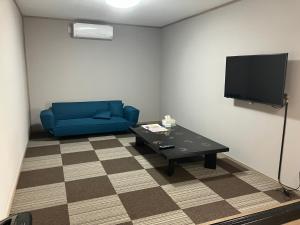 Televízia a/alebo spoločenská miestnosť v ubytovaní The Pine 京都嵐山