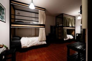 Postel nebo postele na pokoji v ubytování ANOU HOSTEL