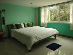 Ein Bett oder Betten in einem Zimmer der Unterkunft Green Home