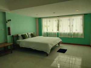 Ein Bett oder Betten in einem Zimmer der Unterkunft Green Home