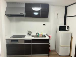 Kuchyň nebo kuchyňský kout v ubytování The Pine 京都嵐山 + 8 fotografií