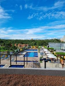 a view of the pool at a resort at Condomínio Recanto do Bosque- Flat Service in Caldas Novas +12 photos