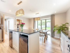 a kitchen with a large island and a dining room at Property 3 - Uk44923 in Wroxall
