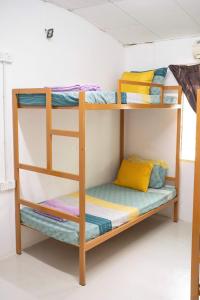 a bunk bed in a dorm room at MIMPIMOON HOSTEL Langkawi in Pantai Cenang +169 photos