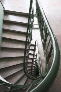 a spiral staircase in a building at ComeCasa Prestigioso Attico in Duomo - San Babila in Milan
