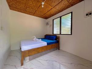 Katil atau katil-katil dalam bilik di Voz Resort