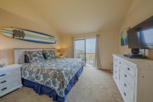 a bedroom with a bed and a surfboard on the wall at Seascape Ocean View Condo in Aptos +73 photos