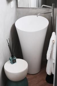 a bathroom with a white toilet and a sink at ComeCasa Prestigioso Attico in Duomo - San Babila in Milan