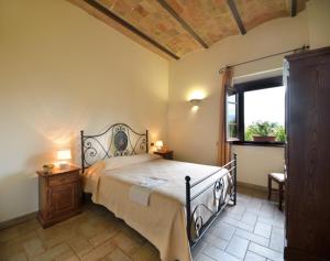 Ένα ή περισσότερα κρεβάτια σε δωμάτιο στο Agriturismo Bellarosa
