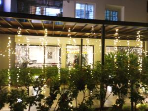 a lit up building with christmas lights at Ranga Vila’s on ECR in Chennai