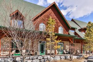 a large brick house with a stone at Mystic Chalet hosted by Fenwick Vacation Rentals in Canmore