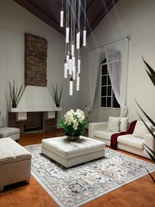 a living room with a couch and a table at Casa dentro del Campo de Golf in Comayagua