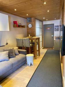 a living room with a couch and a table at Aiguille du Midi - Le Chamo'nid in Chamonix