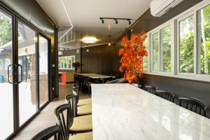 a conference room with a large marble table and chairs at Halo Retreat in Hòa Bình