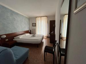 Postel nebo postele na pokoji v ubytování Hotel "ALBERGO DA PINA"