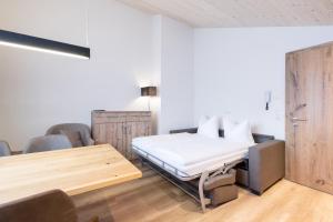 Posteľ alebo postele v izbe v ubytovaní tannberg LODGE