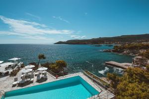 an aerial view of a swimming pool next to the water at Apollo Resort in Agia Marina Aegina