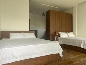 Postelja oz. postelje v sobi nastanitve Tree Homestay
