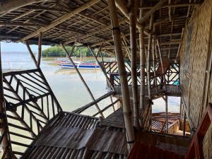 a view from the inside of a boat in the water at Bamboo Nest Beachfront in Puerto Princesa City