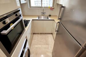 A kitchen or kitchenette at 1 BHK in Hiranandani Gardens Powai