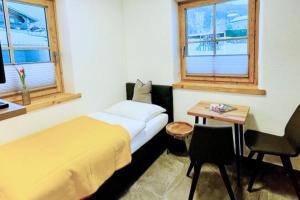 Ένα ή περισσότερα κρεβάτια σε δωμάτιο στο Ferienhaus Mandlberggut