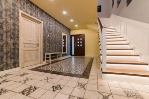 an empty hallway with stairs and a door at Villa Casablanca in Braşov